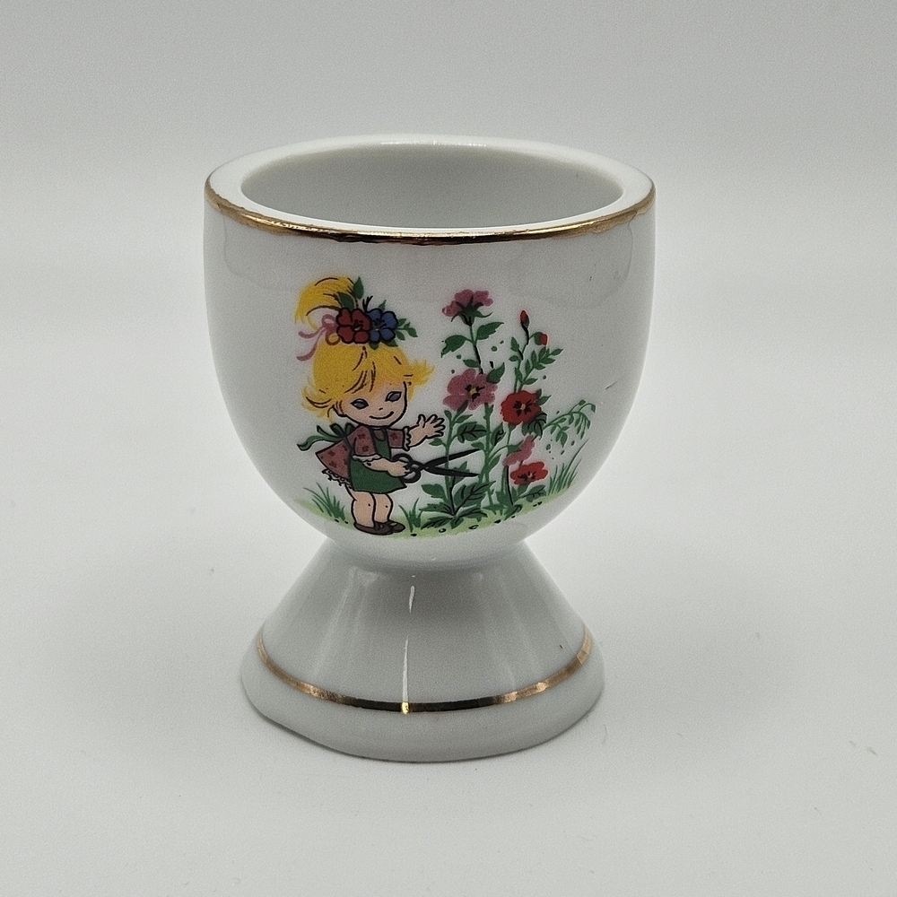 VINTAGE White Porcelain Egg Cup Girl Gardening Gold Trim Detail